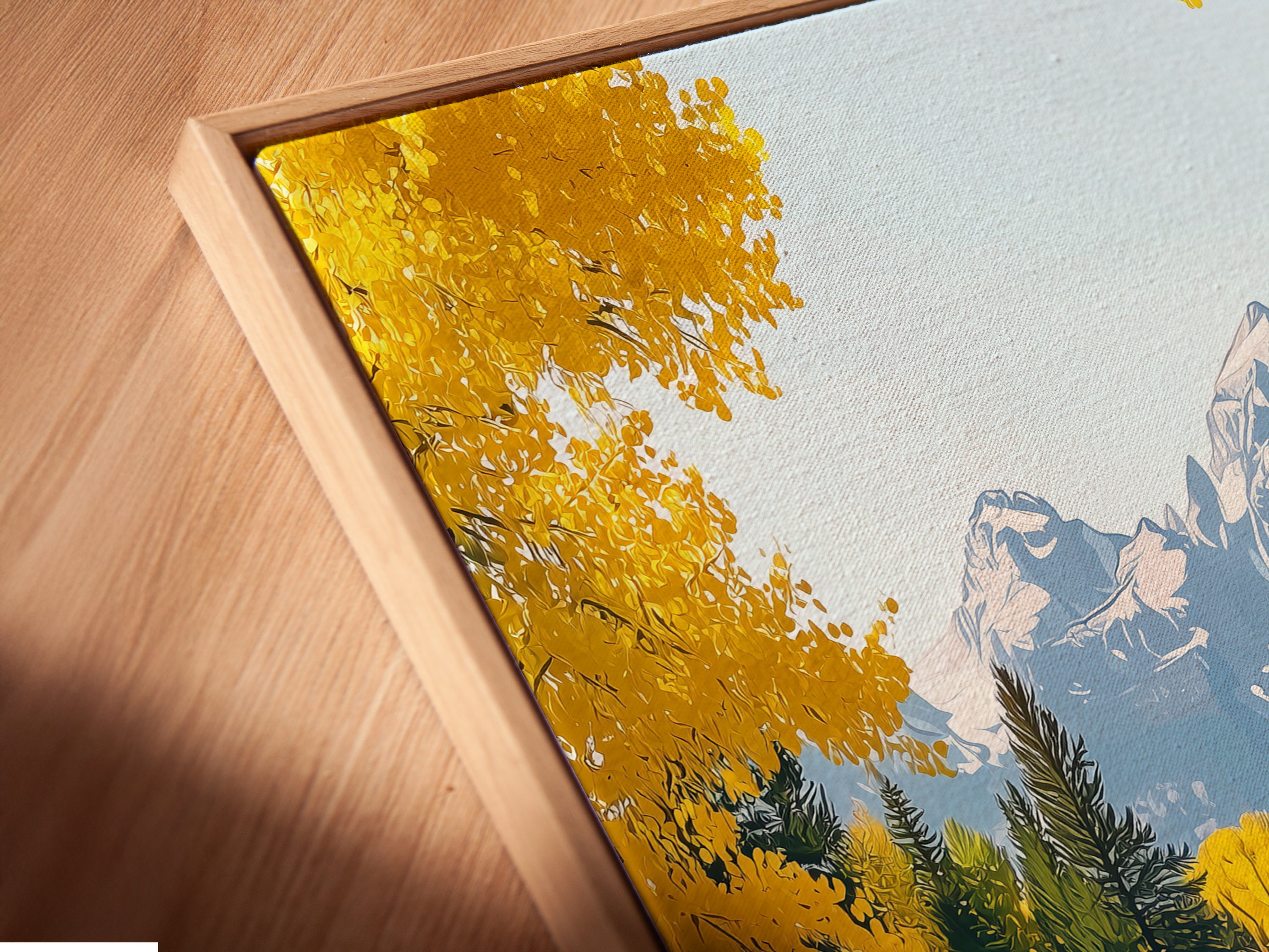 A close-up angled view of a canvas print in a floating frame. The mountain river artwork features an autumn landscape with yellow trees. The floating frame enhances the art. Perfect for modern and rustic interiors.