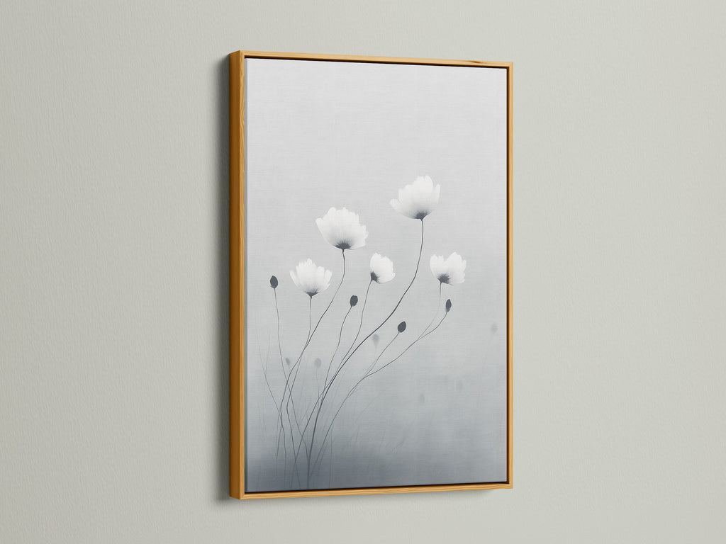 Add a touch of luxury with minimalist flower artwork in a gold frame. This botanical print features soft gray and white tones. It is perfect for modern canvas art in your living room. Gold frames enhance the elegance of delicate flower artwork.