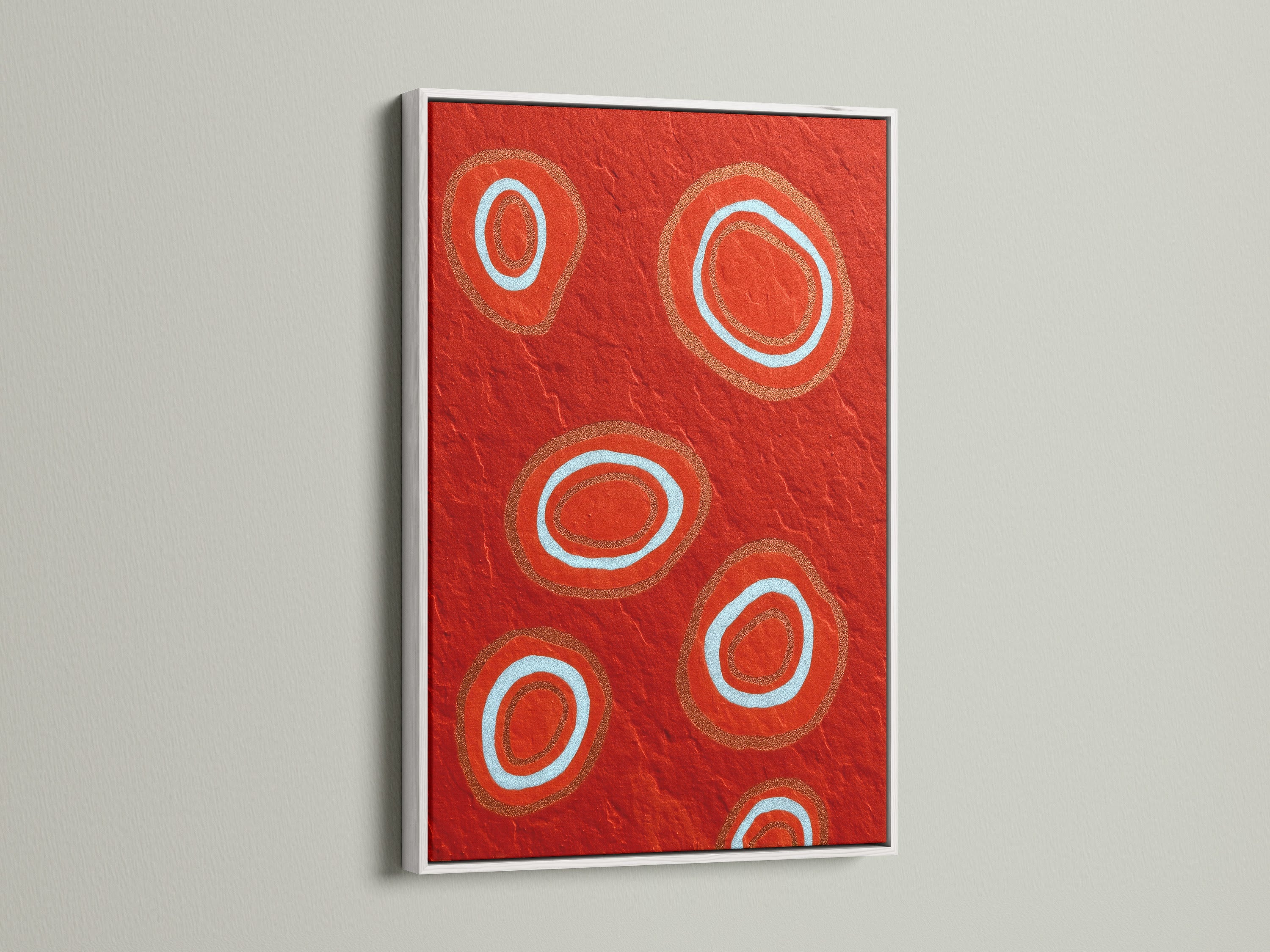 The white frame highlights the striking abstract red artwork. This geometric canvas print brings a modern touch to any room. The bold circle art stands out against the clean white frame. Perfect for a contemporary space seeking vibrant wall decor. A stylish choice for modern art enthusiasts.