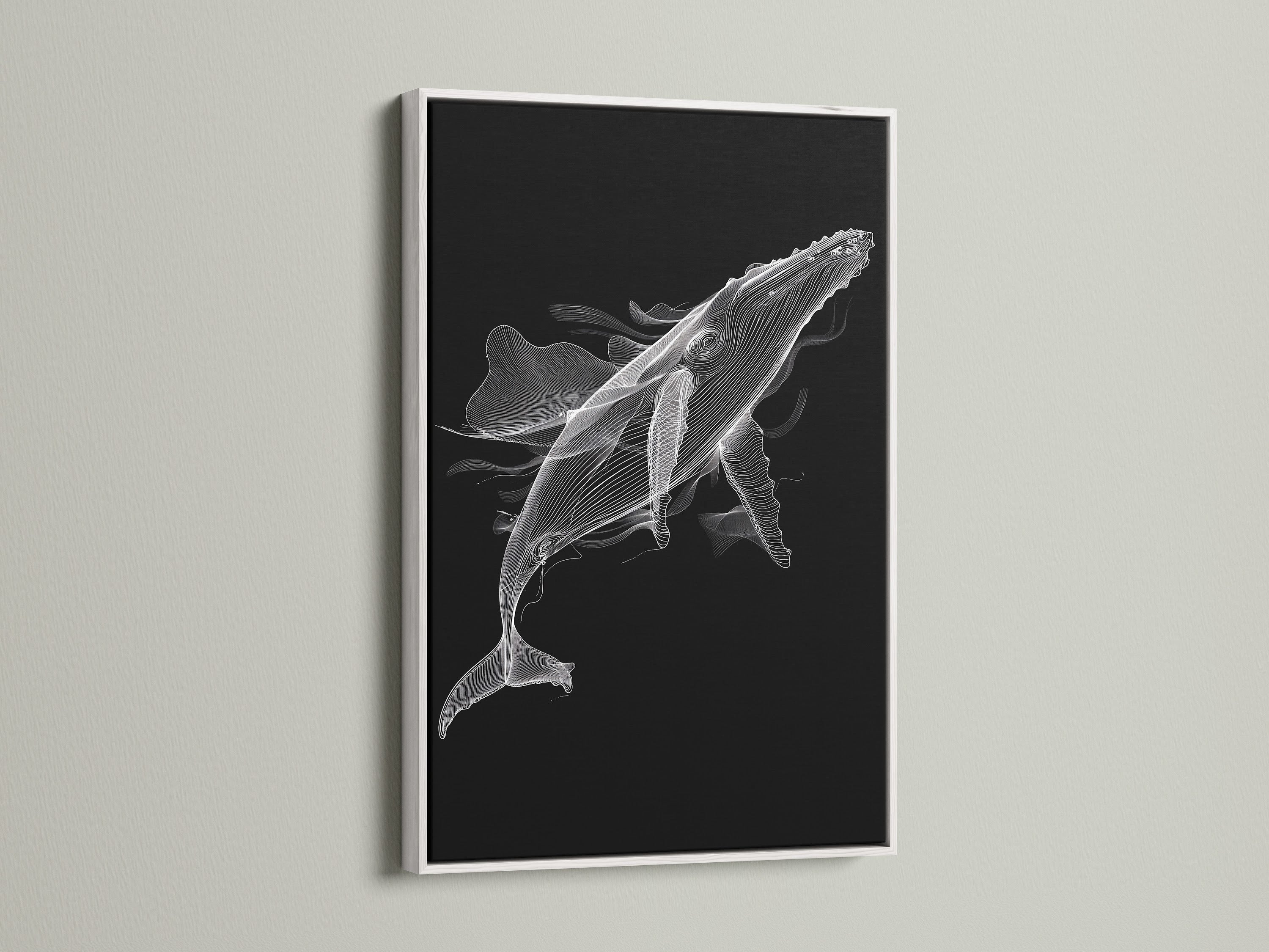 A black and white whale artwork is beautifully framed in a white frame. This minimalist ocean canvas print brings a fresh feel to any room. Ideal for modern bedroom decor. The white frame enhances the whale artwork. This nautical wall decor is a sophisticated addition.