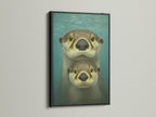 A black frame highlights this cute otter artwork. The teal blue coastal artwork enhances nursery decor. This animal canvas is perfect for adding a touch of whimsy to kids' rooms or family spaces. A charming piece for ocean art lovers.