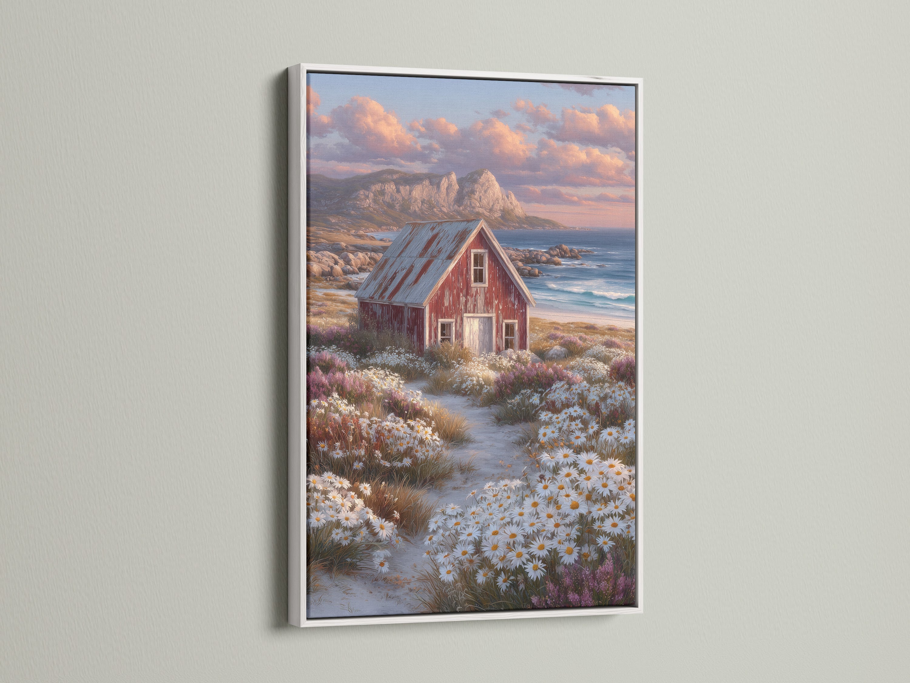 Farmhouse bedroom decor showcasing coastal cottage artwork. The artwork features a rustic red barn and wildflower art. Displayed in a clean white frame. It is perfect for cottage core decor and rustic wall art.