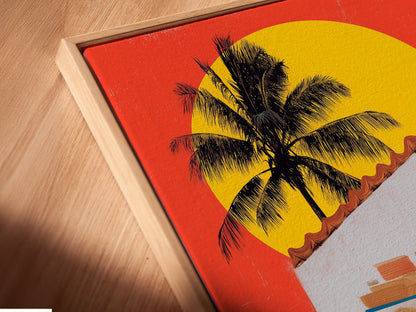 This is an angled close up of a coastal kitchen canvas print in a floating frame. The tropical palm wall art enhances island decor. It is a modern art print perfect for a vacation home. The beach house vibe is captured. A unique piece of coastal artwork.