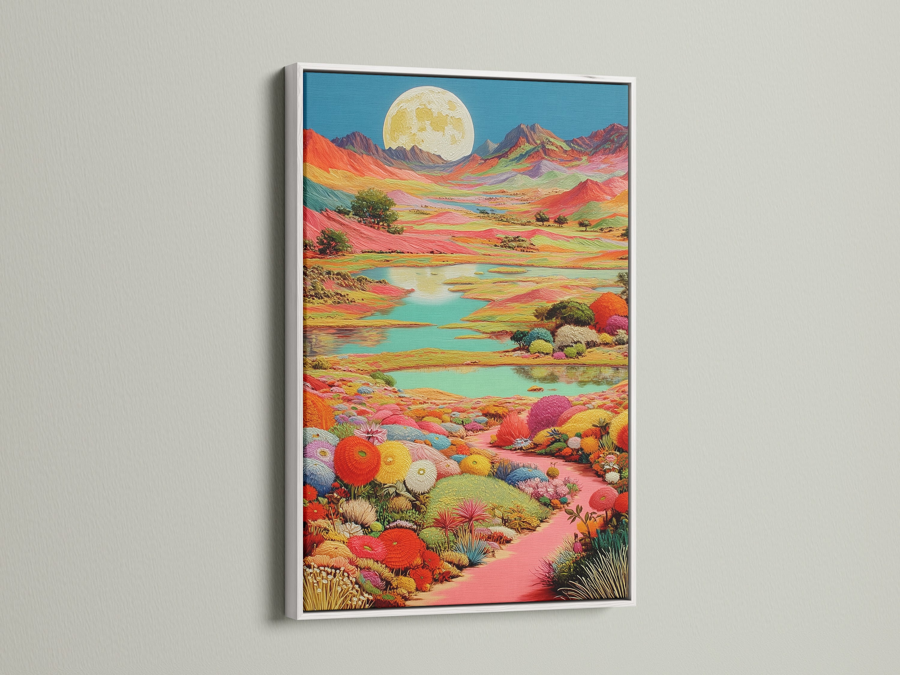 A colorful moon canvas art print is displayed in a clean white frame. The artwork features a whimsical scenery. This piece complements minimalist boho or eclectic styles. It's a great way to brighten up your living room or bedroom wall decor.