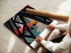 A woman rolls out a fine art poster paper for the City Bridge print. Our fine art paper ensures vibrant colors. The paper brings out the modern urban artwork. Perfect for detailed geometric artwork.