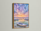 Harbor Sunset canvas print with a gold frame. This beautiful art piece shows fishing boats under a sunset sky. The gold frame enhances the artwork's elegance. The coastal seascape photography adds a touch of luxury to any room. The beige and blue tones create a calming atmosphere. Perfect for adding a touch of glam to your home.