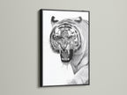 This is a bold tiger artwork set in a sleek black frame. The black frame adds a touch of drama to the artwork. The art piece is perfect for a modern or minimalist space. It brings sophistication and style to any room. The black frame enhances the artwork.