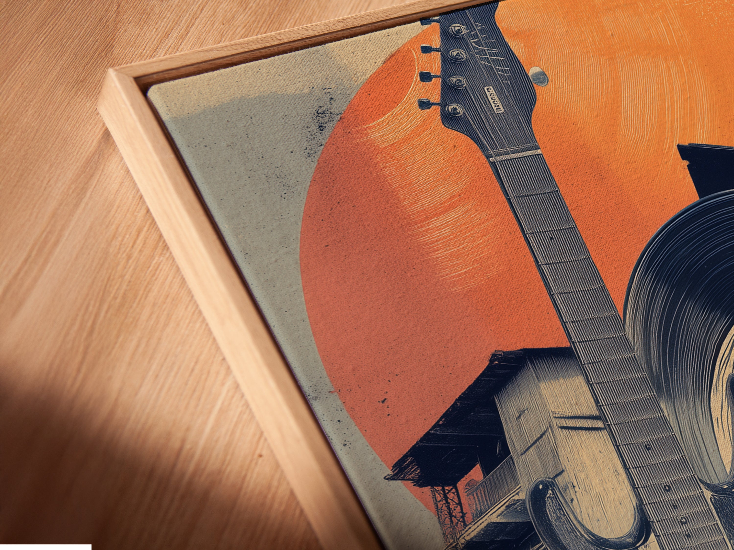 A close up angled view shows a canvas print in a floating frame. The Musical Village artwork features a guitar record and village scene. This modern framing style enhances the artwork's visual impact. It's perfect for contemporary spaces.