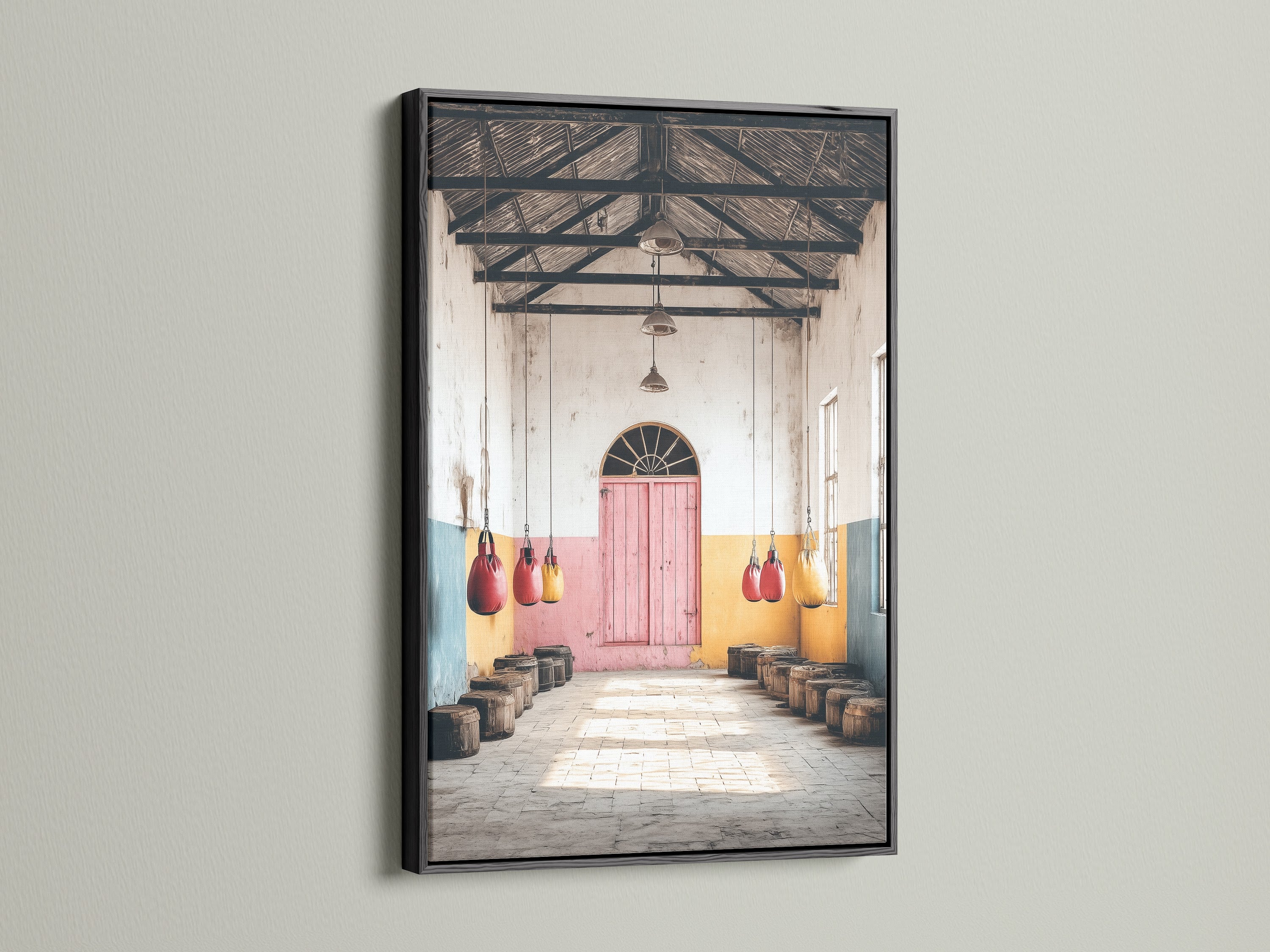 This vintage gym canvas print is framed in black. The artwork's distressed pastel colors create a unique look. This boxing club decor suits industrial and eclectic styles. This sport gift is ideal for a man cave or gym. The black frame adds contrast.