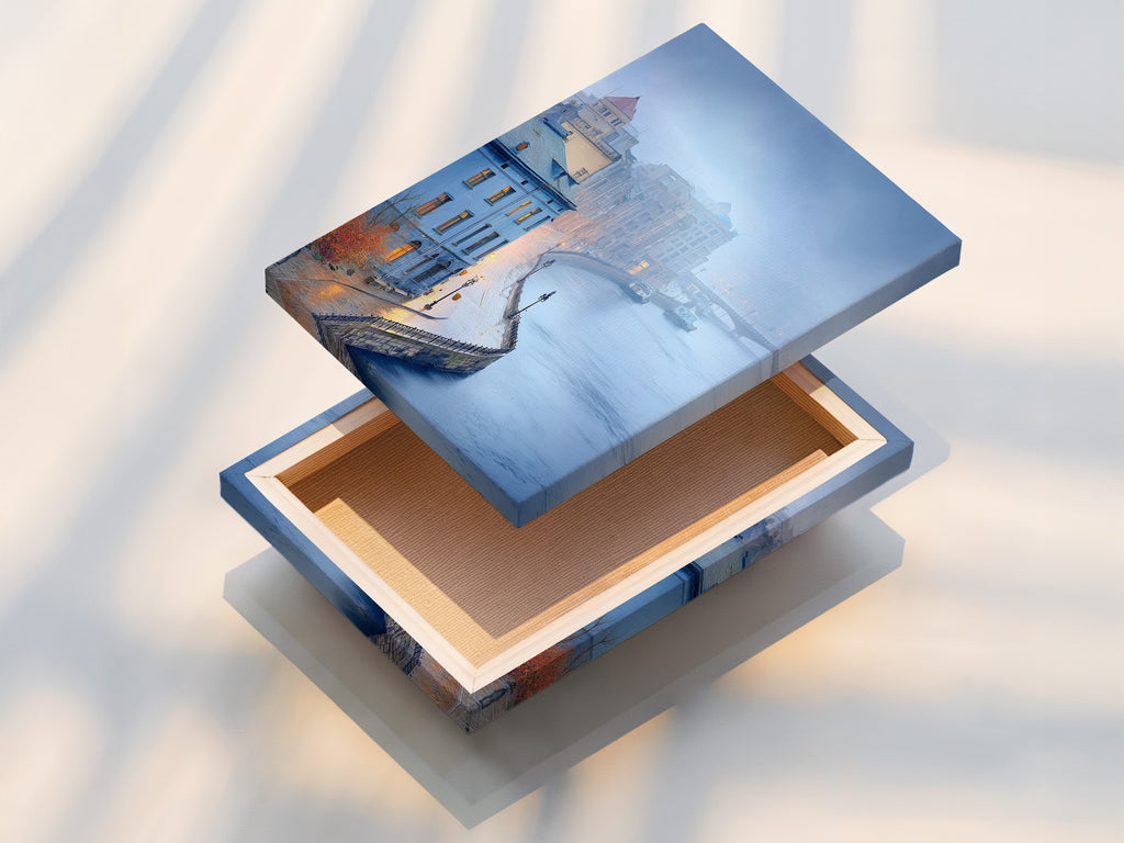 This is a stretched canvas print of cityscape river artwork. It showcases European architecture with misty cityscape photography. This blue wall art is perfect for office decor. Enhance your space with an urban landscape.