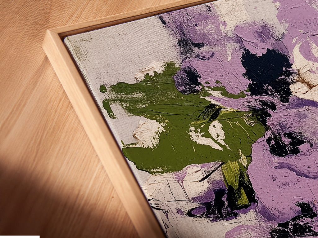 A close-up angled view of a canvas print in a floating frame. The artwork showcases abstract floral patterns with purple and green hues. This contemporary botanical print adds a modern touch to any space. The floating frame enhances the artwork's visual appeal and style.