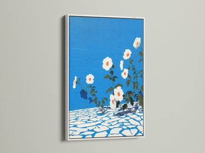 A white frame enhances the beauty of this floral canvas art. The botanical print features azure blue and is ideal for entryway wall decor. This flower artwork complements minimalist and Scandinavian styles.
