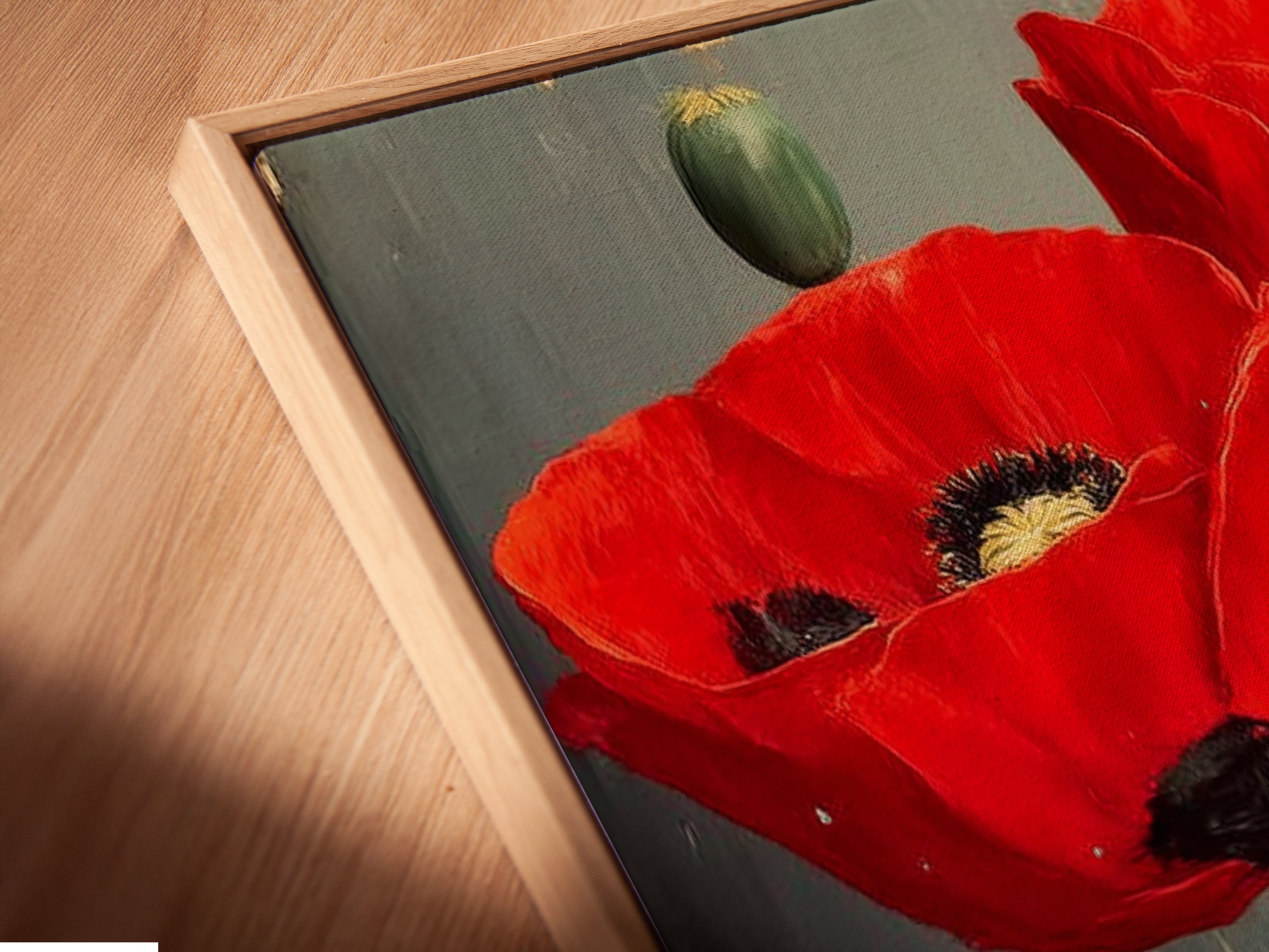 A close-up angled view reveals a canvas print in a floating frame. This red poppy floral artwork adds depth and dimension to any space. Perfect for showcasing vintage flower photography. Elevate your decor with botanical wall art.