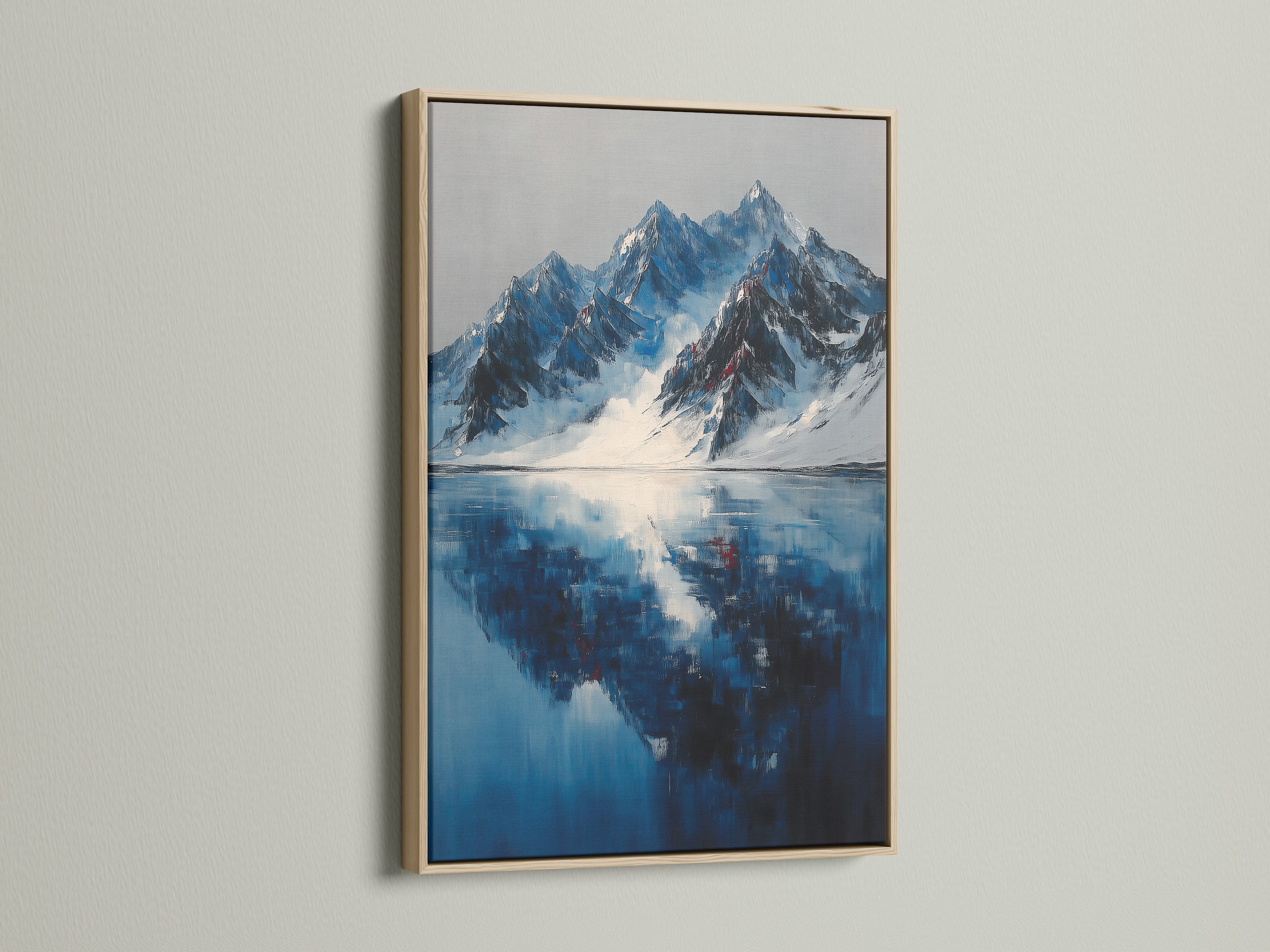 Oak frame showcasing mountain reflection artwork. The lake canvas and indigo wall art create a serene winter landscape for office decor. This frame enhances the modern wall art perfect for homeowners and interior art styles. Snowy mountains are reflected beautifully.