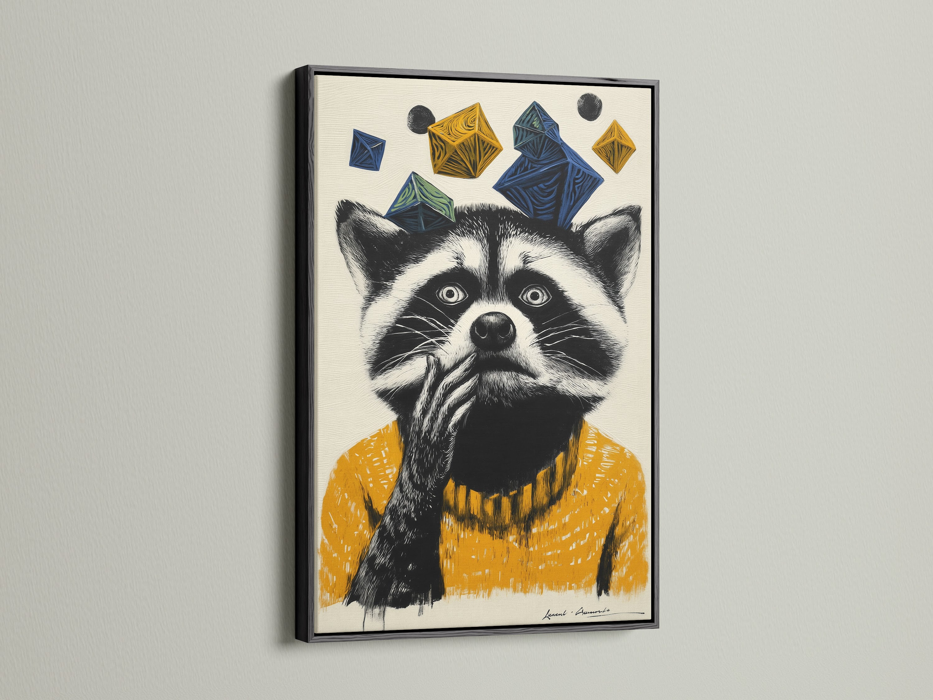 This image displays a modern raccoon artwork in a sleek black frame. The animal canvas print features a raccoon wearing a mustard yellow sweater. Blue and yellow geometric shapes add a playful element. This quirky wall decor is perfect for a contemporary kids room. The geometric animal art brings a touch of whimsy.
