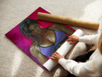 A woman is carefully rolling a fine art poster paper. The paper features a fitness woman artwork. Ensuring quality and precision. Ready to be framed and displayed. Perfect for gym decor and workout inspiration.