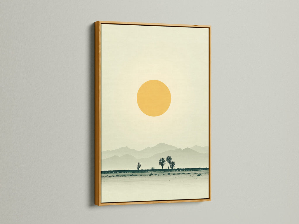 This is a desert landscape canvas print. It is showcased in a gold frame. The artwork has warm earth tones. It is minimalist wall art. The print brings southwestern decor to a home office. It creates a calming and inviting atmosphere.