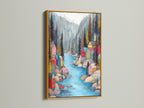 Village River colorful art in a gold frame. The gold frame adds a touch of elegance and luxury. The whimsical decor shines with the gold accent. It brings a warm and sophisticated feel to your home. This piece is ideal for adding a touch of glamor to your living room.