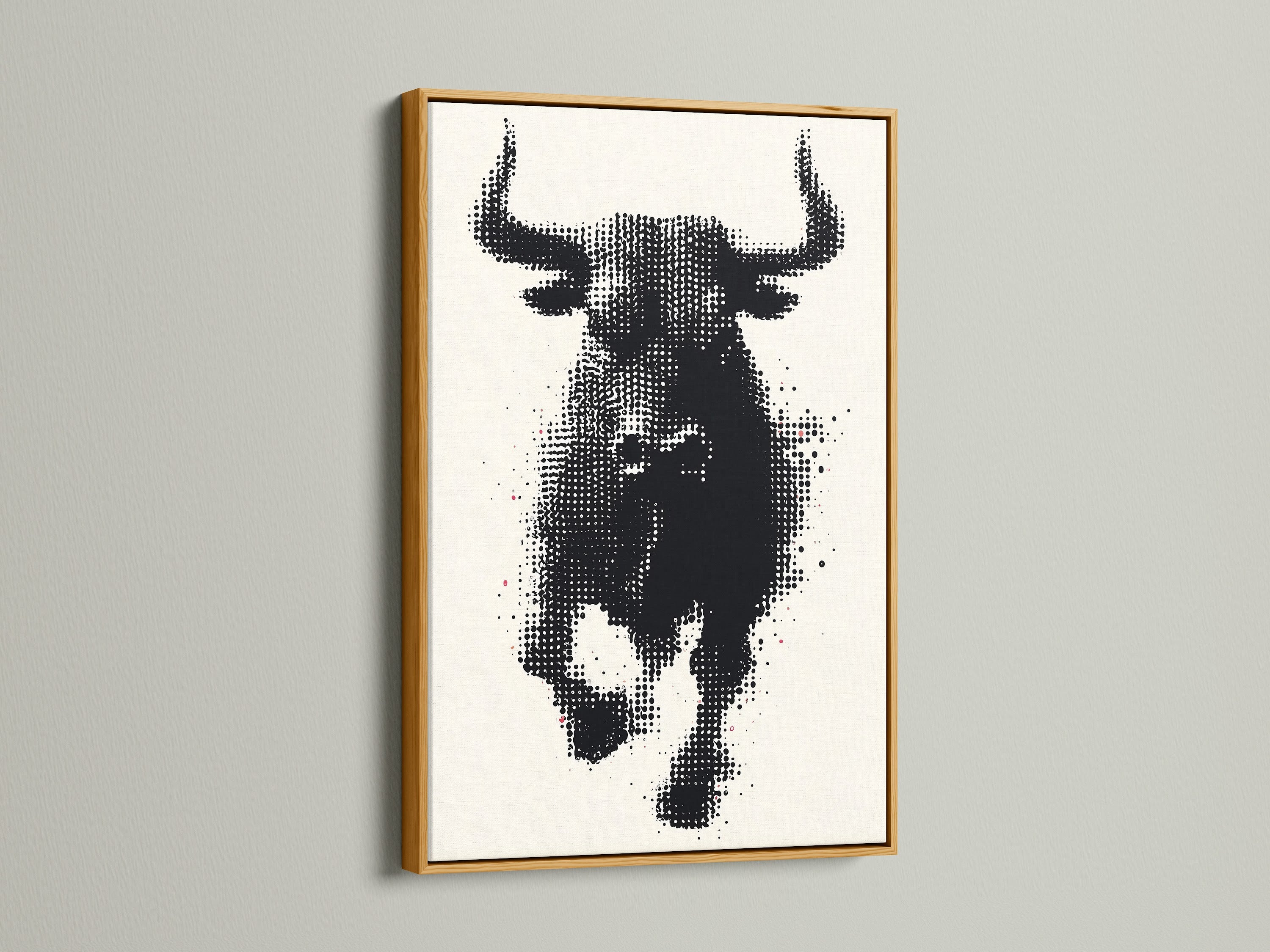 A bull art print is displayed in a gold frame. This piece adds a touch of luxury to any room. The gold frame enhances the black and white halftone artwork. It is perfect for elevating your living room or office decor. This animal canvas print offers a sophisticated and stylish touch. Transform your space with this elegant artwork.