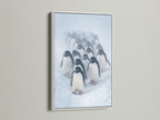 Penguin Parade artwork showcased in a white frame. The bright white enhances the snow scene in the antarctic print. This animal art print is perfect for nursery wall art or a Scandinavian-style living room. A serene winter wall decor choice.