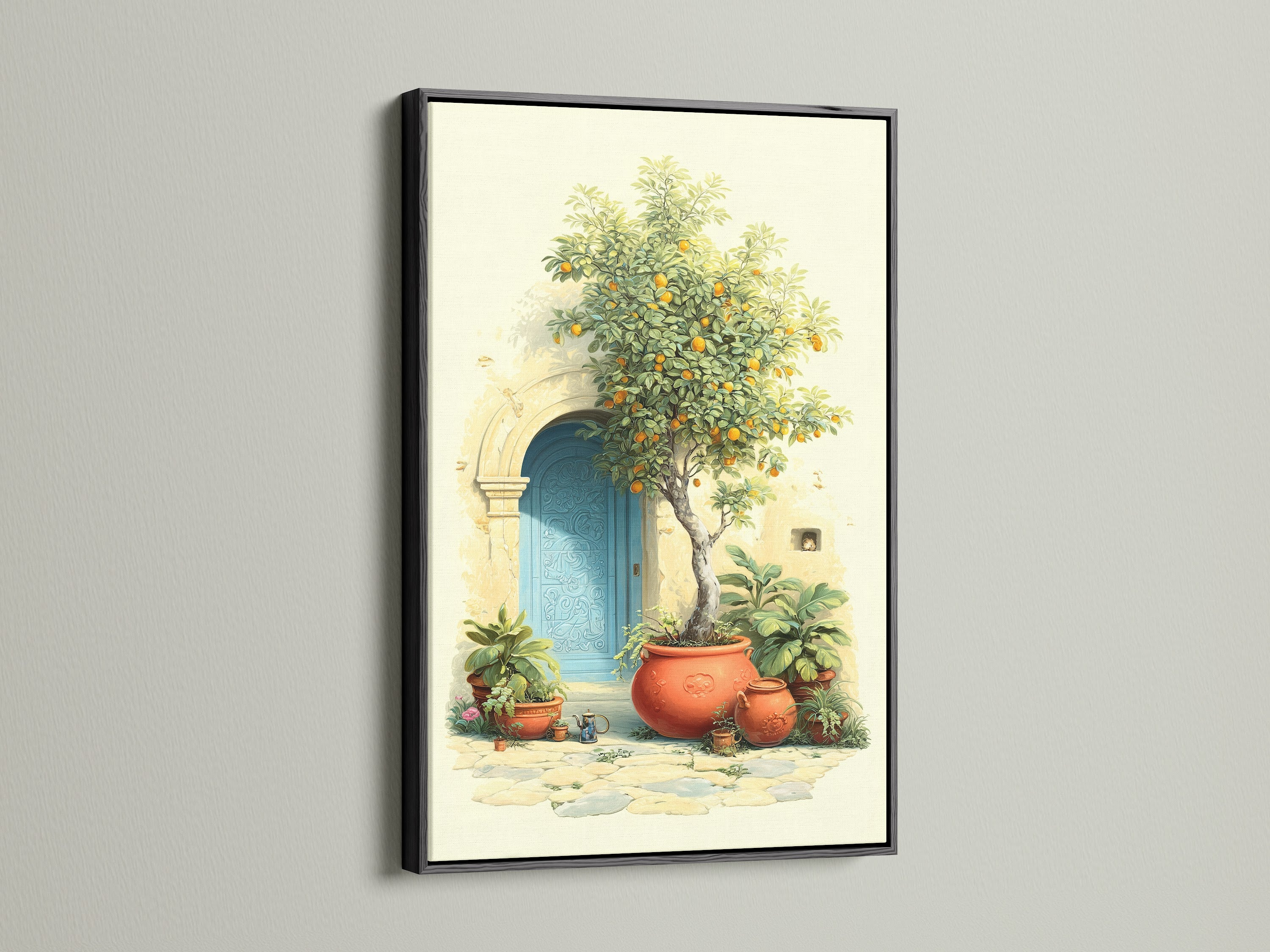Italian Lemon Tree artwork displayed in a black frame. This Mediterranean art brings Tuscan doorway charm to any room. The canvas print features an azure door terracotta pots and bright citrus adding a touch of Italian garden ambiance to your kitchen or living room.