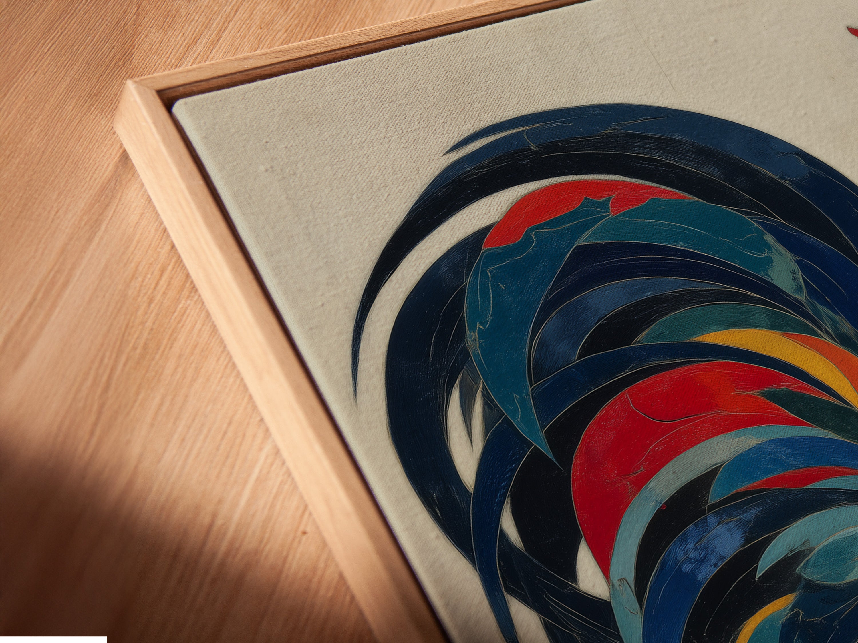 A close-up angled view of the canvas print in a floating frame. The floating frame gives the artwork a modern and sophisticated look. The colorful rooster artwork appears to float within the frame. This enhances its visual appeal and makes it a standout piece.