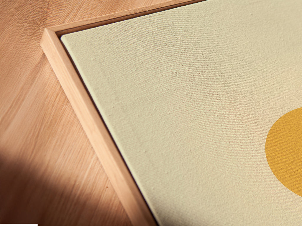 A close-up angle showcases a canvas print. The floating frame adds depth to the desert landscape artwork. The warm earth tones complement any decor. It is minimalist wall art. This print brings southwestern decor to a home or office.