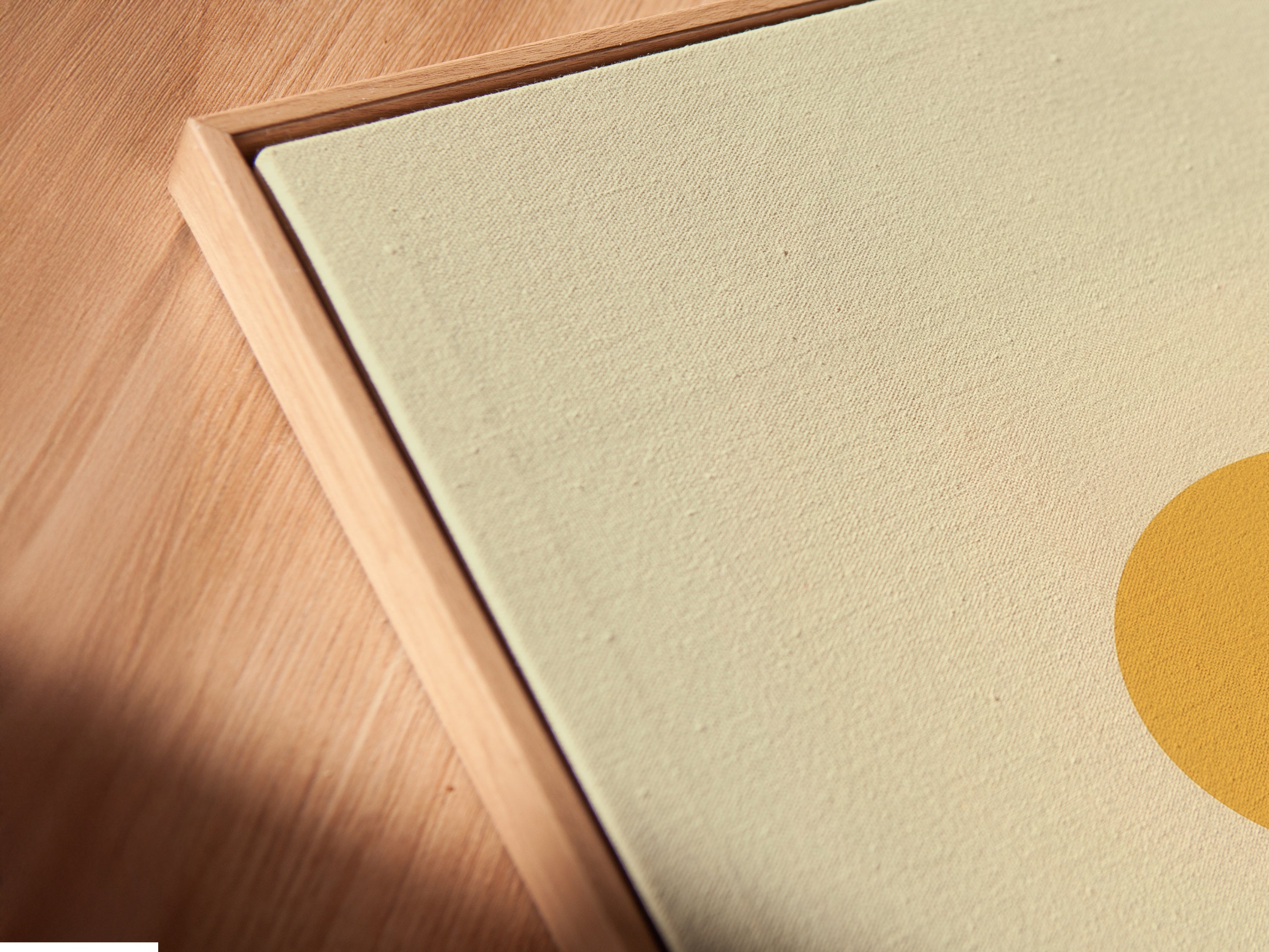 A close-up angle showcases a canvas print. The floating frame adds depth to the desert landscape artwork. The warm earth tones complement any decor. It is minimalist wall art. This print brings southwestern decor to a home or office.