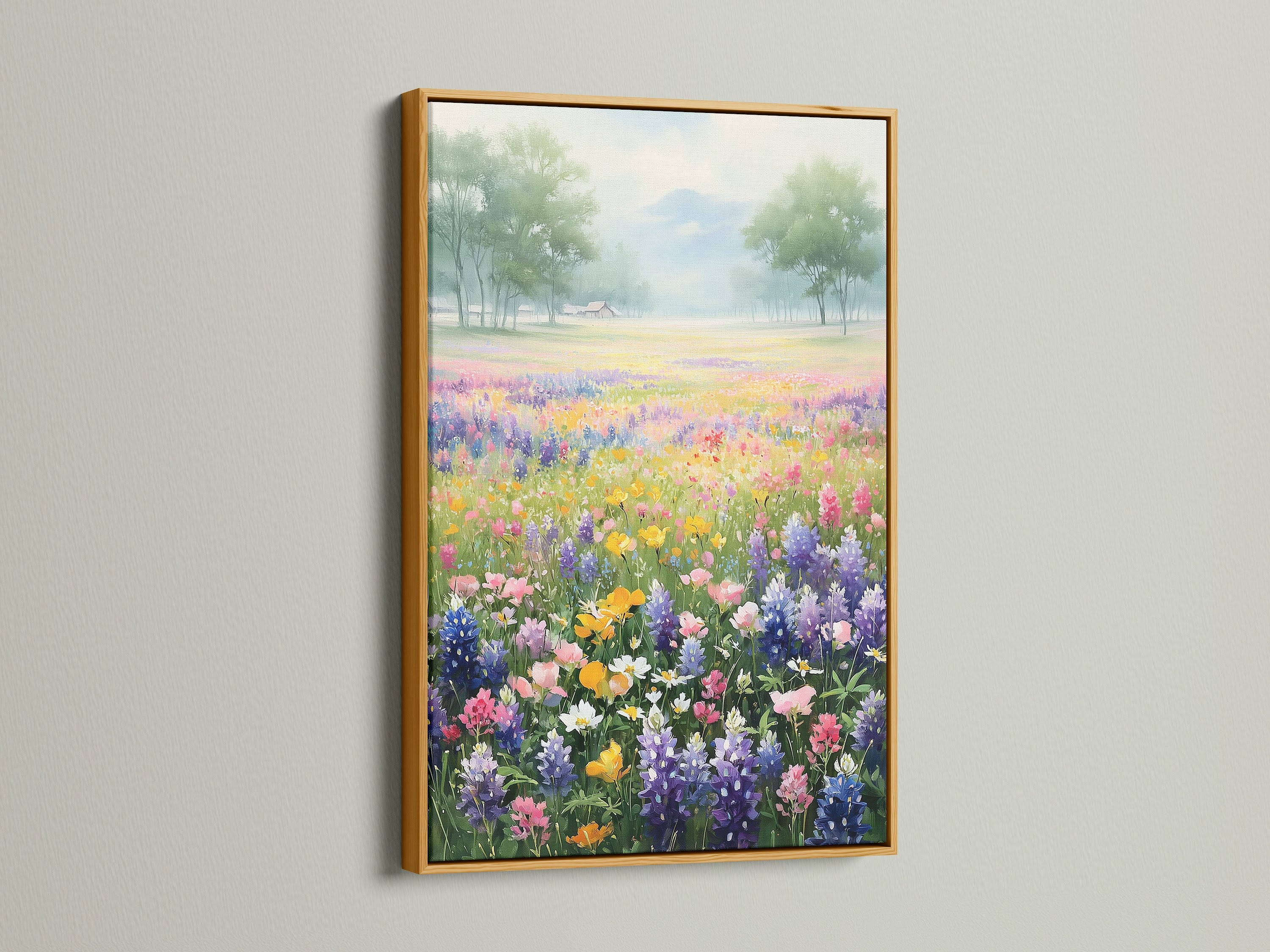 A beautiful wildflower field artwork is displayed in a gold frame. This spring landscape brings a touch of elegance. Enhance your space with this colorful meadow canvas. This botanical wall art is perfect for any room.