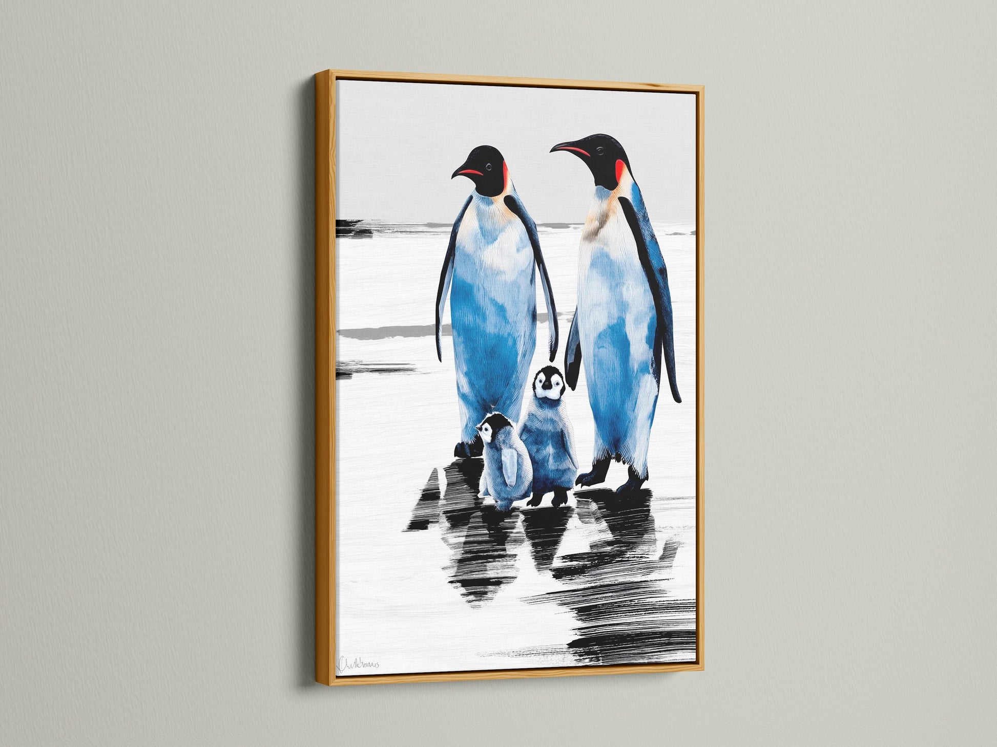 Penguin art print with a gold frame. The arctic canvas creates a coastal atmosphere. It is a perfect piece of animal artwork for blue and white themed rooms. This winter wall art makes a charming animal lover gift.