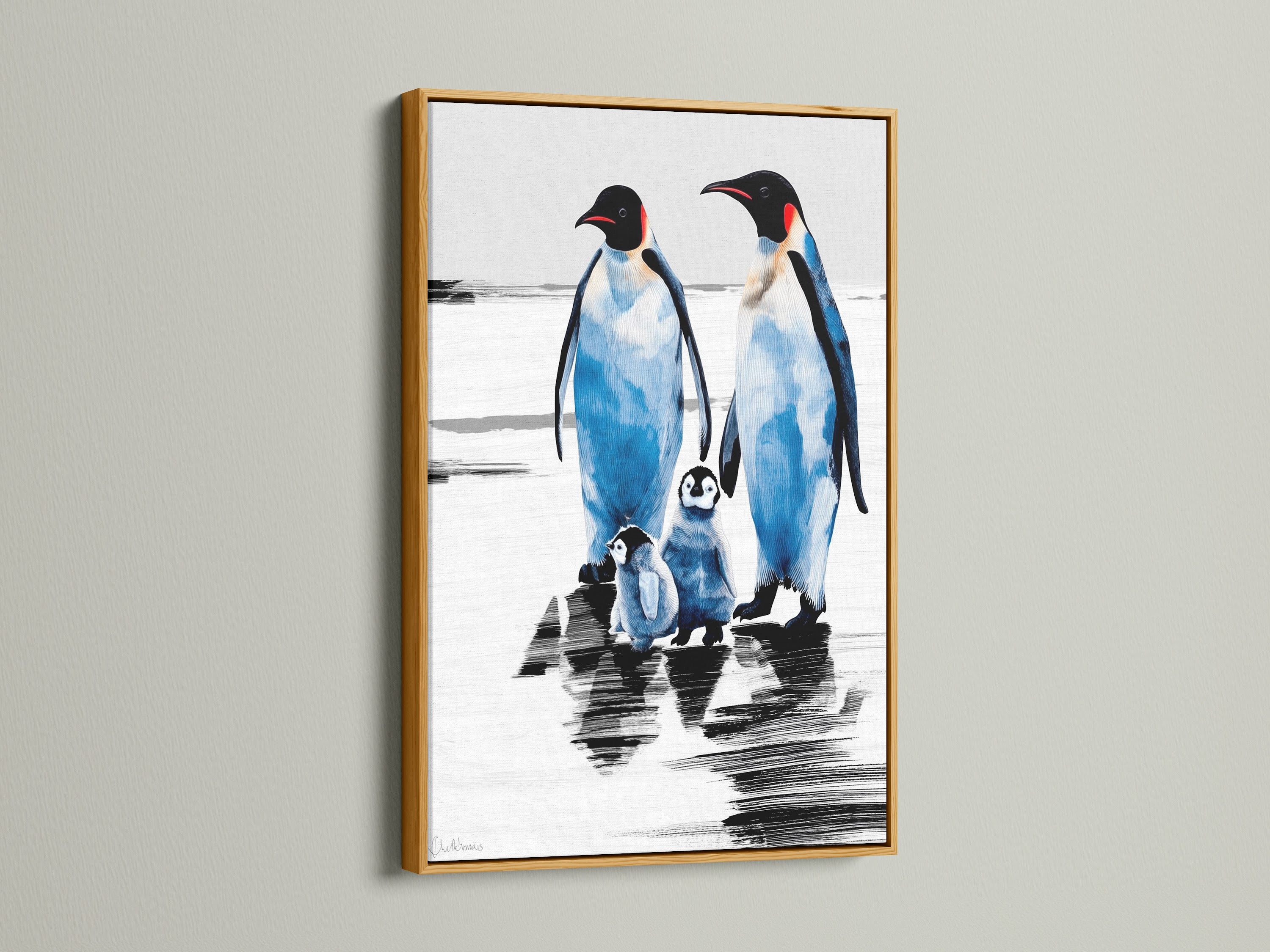 Penguin art print with a gold frame. The arctic canvas creates a coastal atmosphere. It is a perfect piece of animal artwork for blue and white themed rooms. This winter wall art makes a charming animal lover gift.