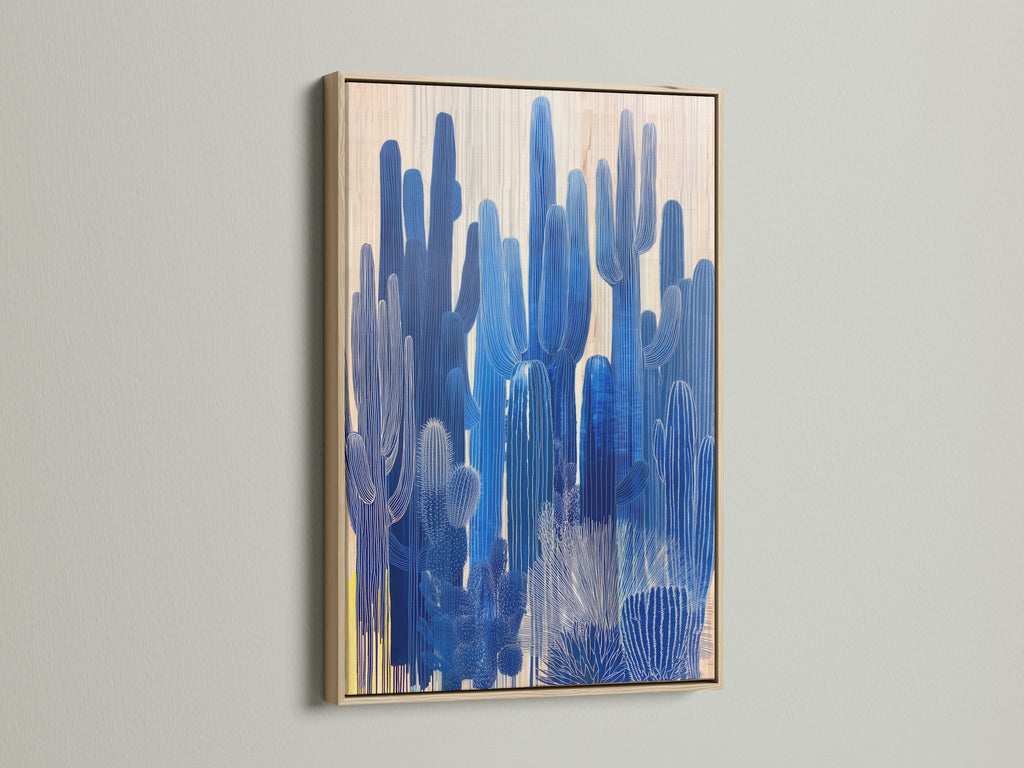 Oak frame art featuring a blue cactus print. This desert canvas enhances your home office decor. Consider this blue botanical artwork for southwest wall art. Perfect for minimalist and Scandinavian styles.