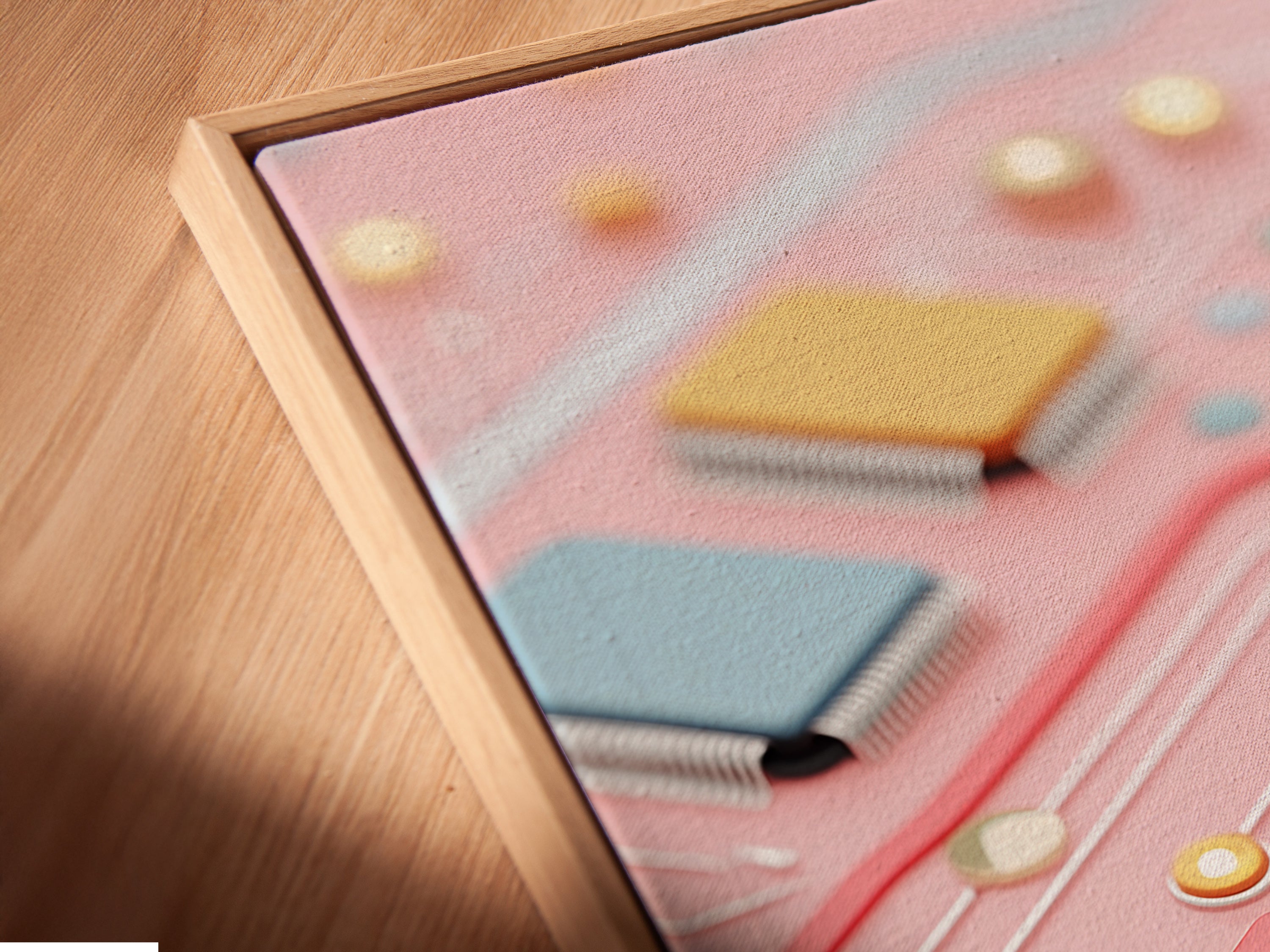 Angled close-up of a pastel pink circuit board canvas print in a floating frame. The computer chip art offers a modern tech aesthetic. Ideal for adding a unique touch to offices or living spaces with this eye-catching piece.
