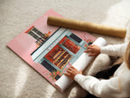 A woman rolling a fine art poster paper. The poster paper is high-quality. It is ready for printing a beautiful artwork. This image showcases the care and precision involved in preparing fine art prints. It is perfect for decorating your home or office.