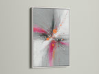 Abstract Burst artwork in a sleek white frame. The pink orange and gray hues create a dynamic explosion print. This contemporary artwork is perfect for modern spaces. Brighten up your living room bedroom or office with this vibrant art. The white frame offers a clean look.