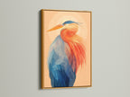 Framed heron art print with a gold frame. This coastal wall art brings a touch of elegance to your space. The avian artwork features a beautiful blue and orange heron. The gold frame enhances the artwork's vibrant colors. Perfect for adding a luxurious and modern touch to any room or office.