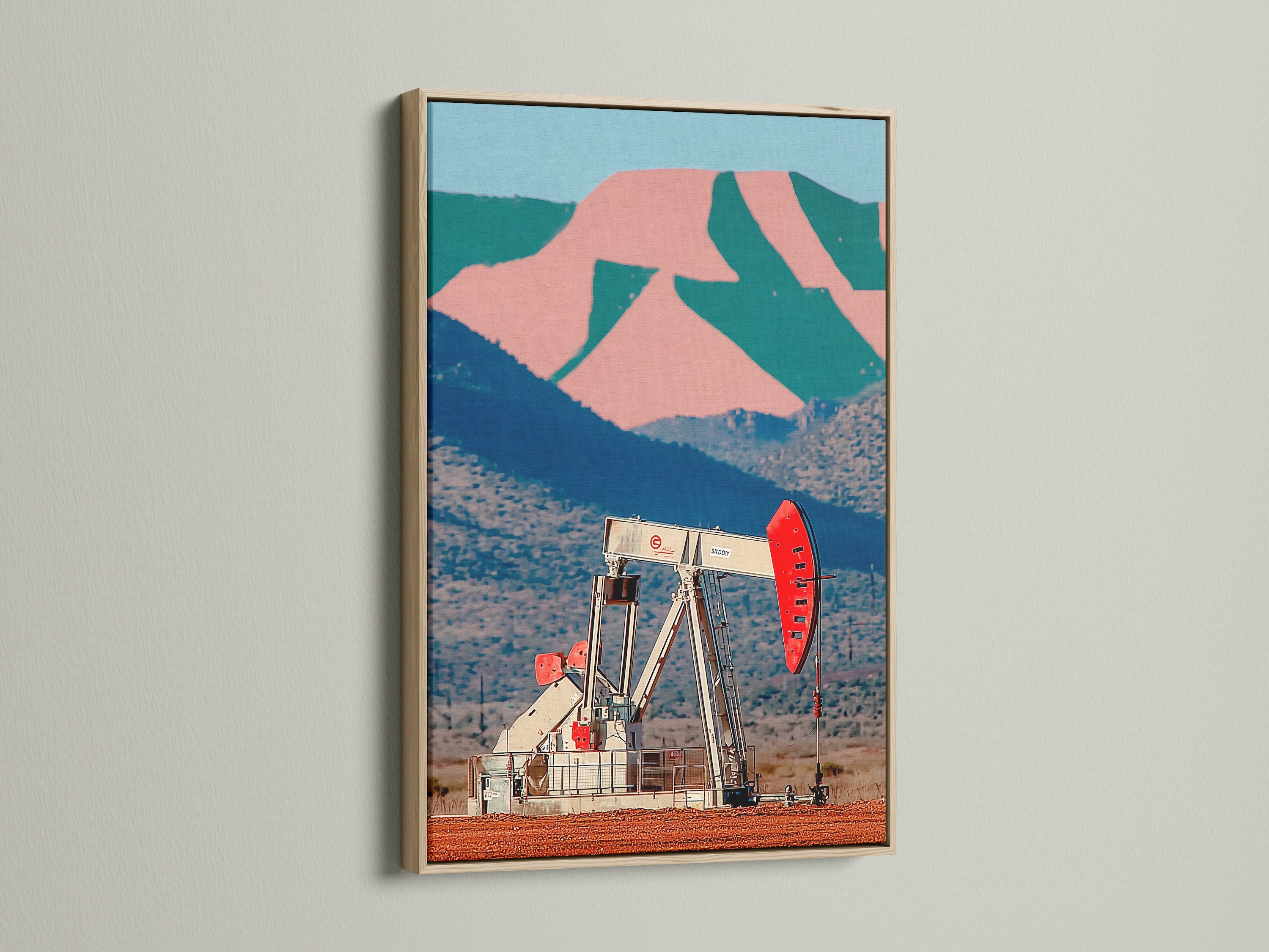 Desert oil pump canvas artwork in an oak frame. The pop art canvas features a retro industrial scene. Perfect for office wall decor or vintage Americana art. The desert landscape adds a southwestern touch.