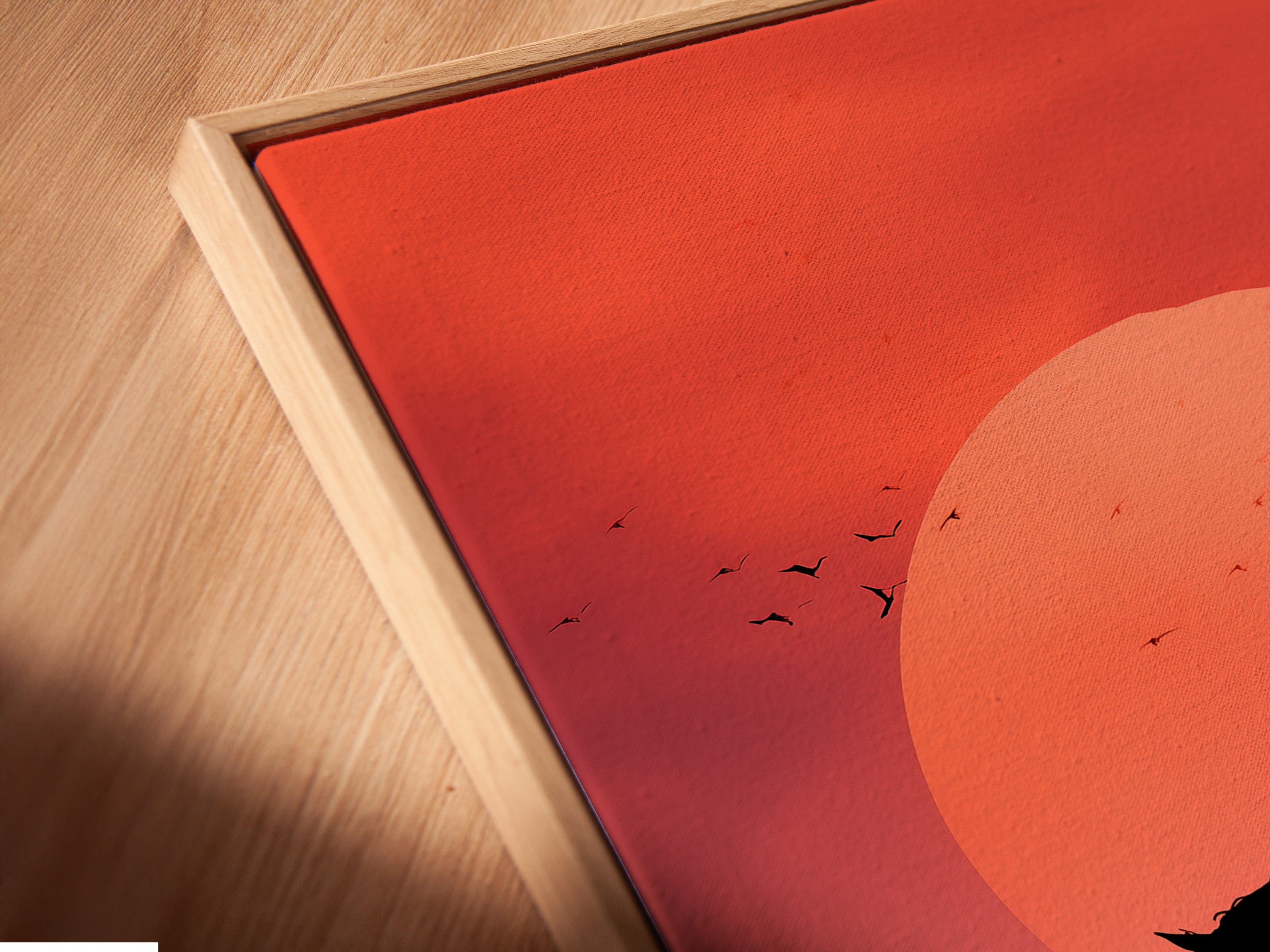 This is a close-up shot of a canvas print. The canvas features an artwork of an indigenous person on horseback at sunset. It is set in a floating frame. This elegant framing style enhances the artwork. It creates a modern look.