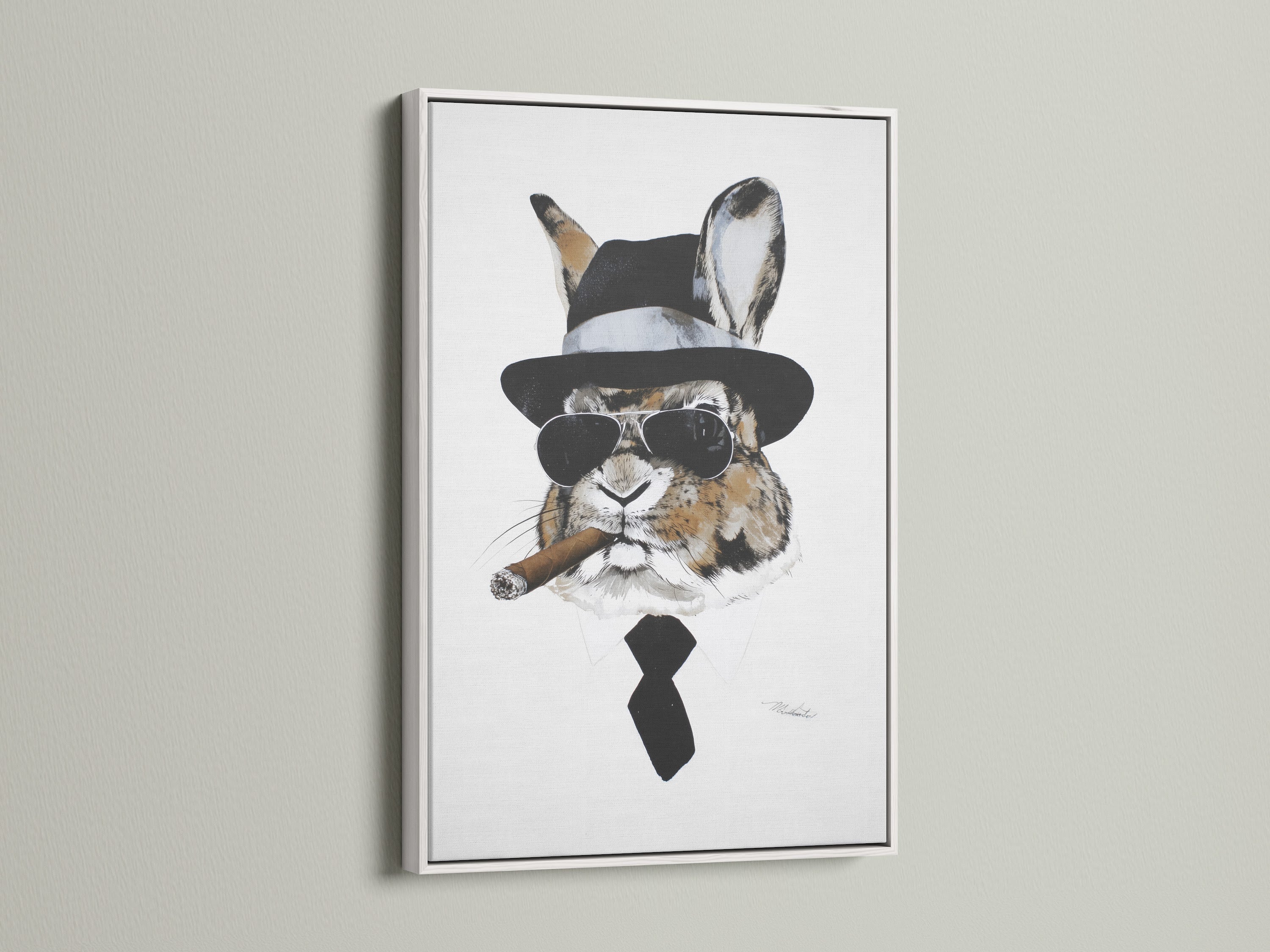 Gentleman Rabbit artwork in a white frame. This whimsical wall decor is perfect for any space. The white frame offers a clean modern look. It's a great choice for contemporary interiors. This bunny canvas print brings character to your walls.