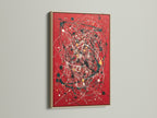 A striking red canvas print featuring abstract wall art. The artwork is beautifully framed in oak. This modern piece uses splatter art and paint drips for a contemporary look. Ideal for adding a bold statement to any room. Perfect for those seeking modern home art.
