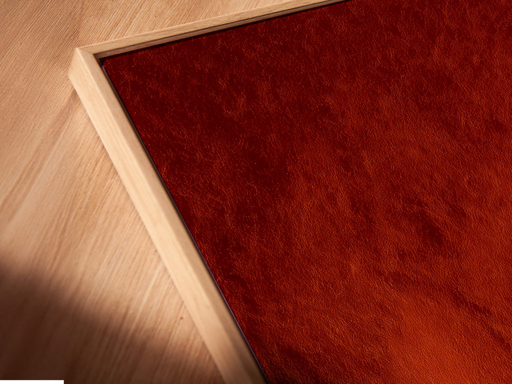 Angled close-up of a canvas print in floating frame. The frame enhances terracotta adobe arches artwork. The art is Southwestern minimalist decor. Perfect for a bedroom or living room. The floating frame adds sophistication.