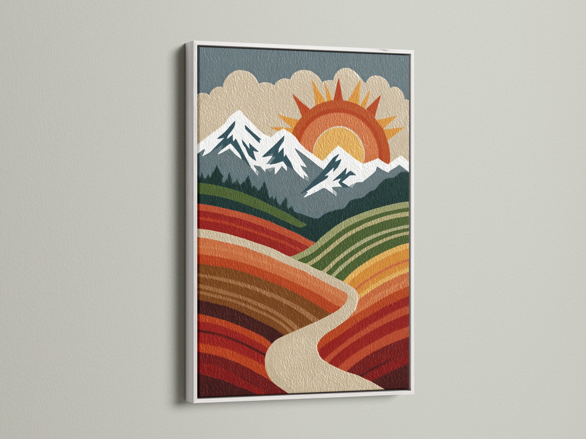 Boho mountain landscape artwork with a white frame against a clean white wall. This piece features a retro sun mountains and valley. The white frame provides a modern touch. This is ideal for a minimalist or bohemian interior.