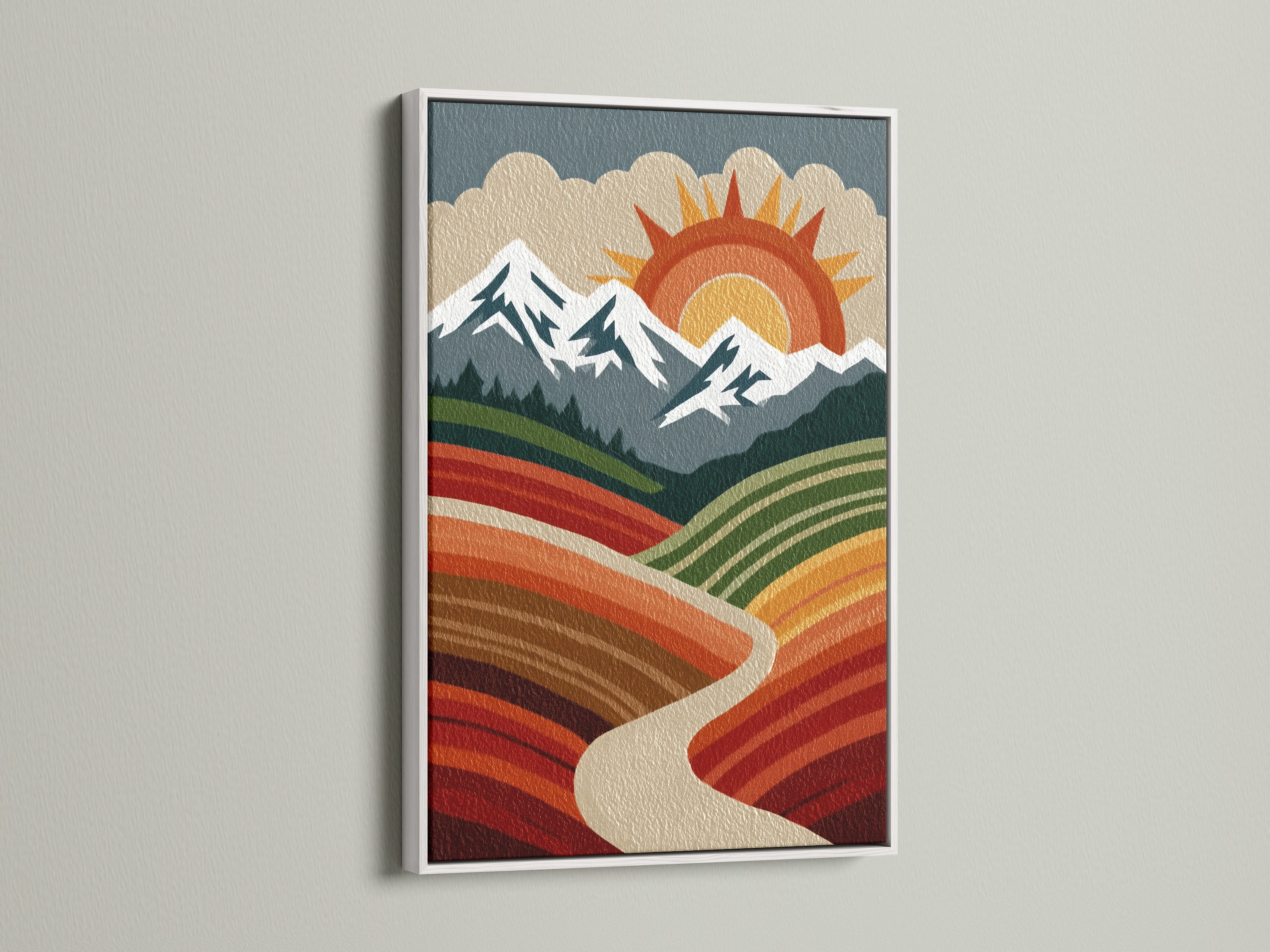 Boho mountain landscape artwork with a white frame against a clean white wall. This piece features a retro sun mountains and valley. The white frame provides a modern touch. This is ideal for a minimalist or bohemian interior.