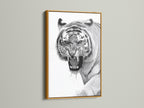 The tiger artwork is presented in a luxurious gold frame. The gold frame adds a touch of opulence to the art piece. It creates a focal point that is eye catching and elegant. This artwork elevates your home decor. It brings warmth and sophistication to your space.