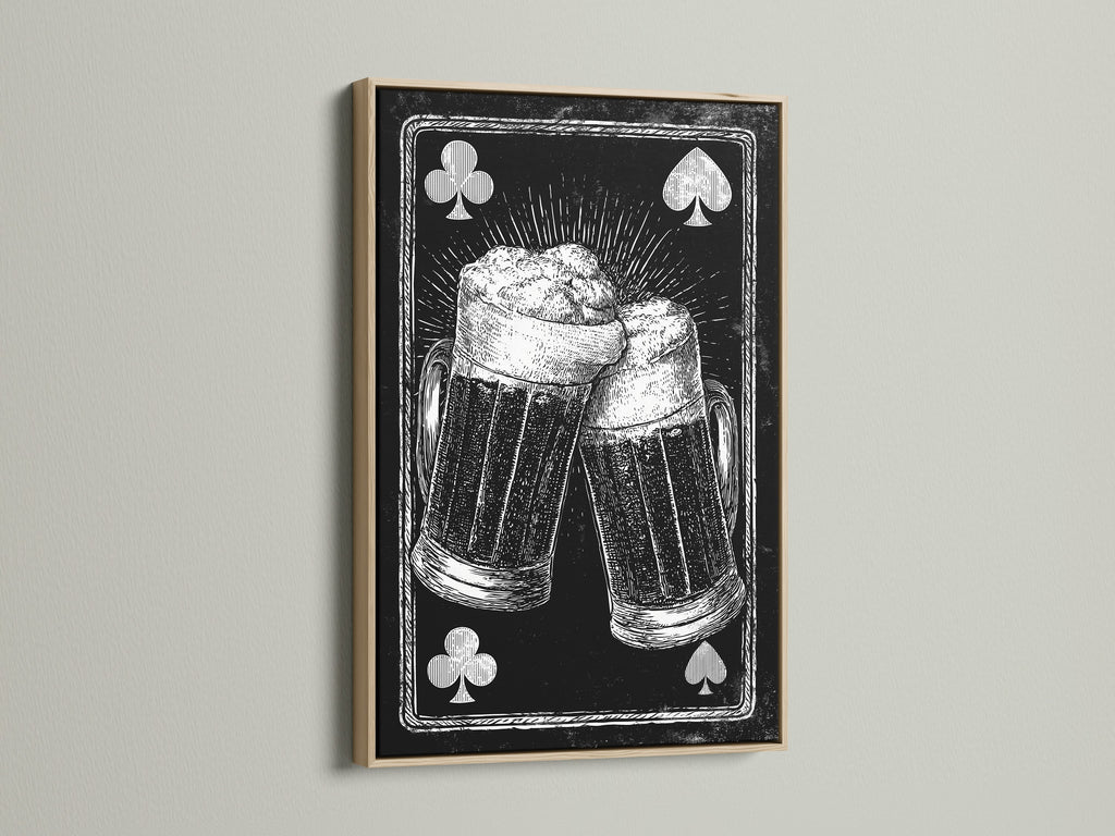 Framed artwork featuring a playing card beer mug art print. The artwork is framed in an oak frame. The oak frame enhances the vintage feel of the artwork. A great addition to any home decor.