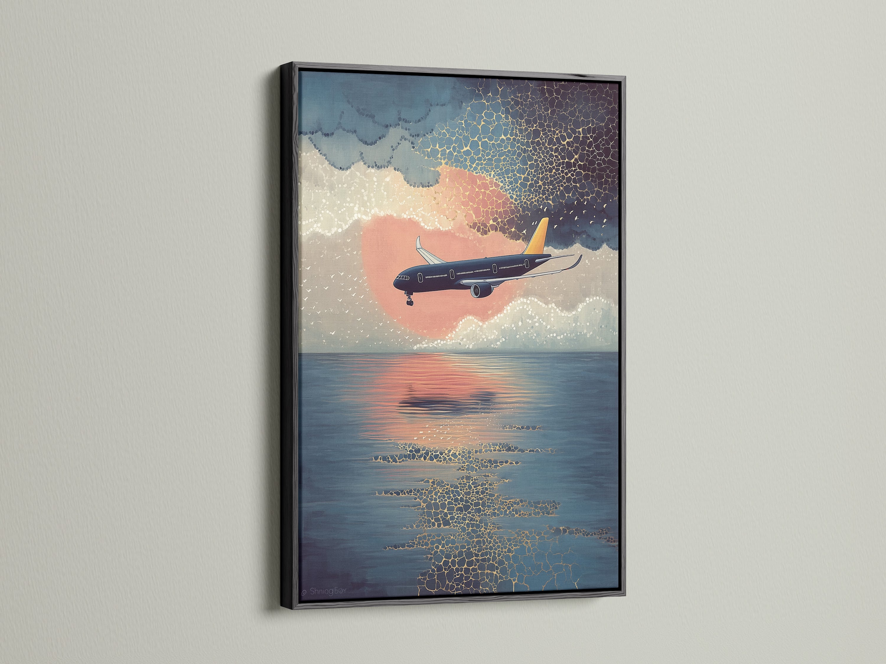 Elevate your space with our airplane canvas print. This sunset flight wall art features a coastal sky artwork. It is displayed in a black frame. Perfect aviation poster for office decor. A modern print that brings blue orange art to life.