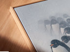 A close-up of a canvas print in a floating frame showcasing penguin artwork. Perfect for adding a modern touch to any space. The floating frame enhances the artwork making it a focal point. This is ideal for coastal or minimalist interiors.