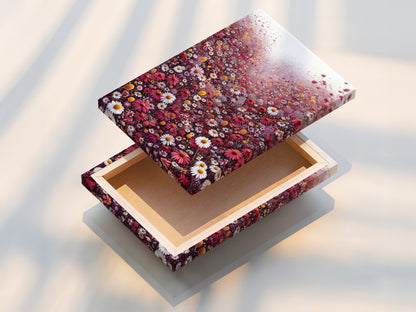 This stretched canvas print showcases a vibrant floral meadow. The artwork features a field of red and white wildflowers. This ready-to-hang botanical artwork brings nature indoors. Perfect for adding a touch of spring to your home or office decor.