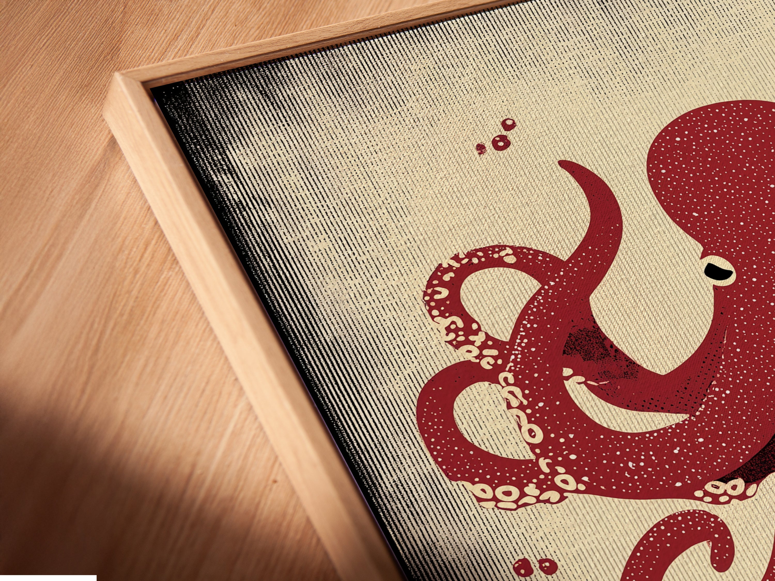 Close-up angled view of a canvas print featuring the red octopus in a floating frame. This modern framing style enhances the artwork. Ideal for those seeking unique sea creature art. Elevate your space with art.