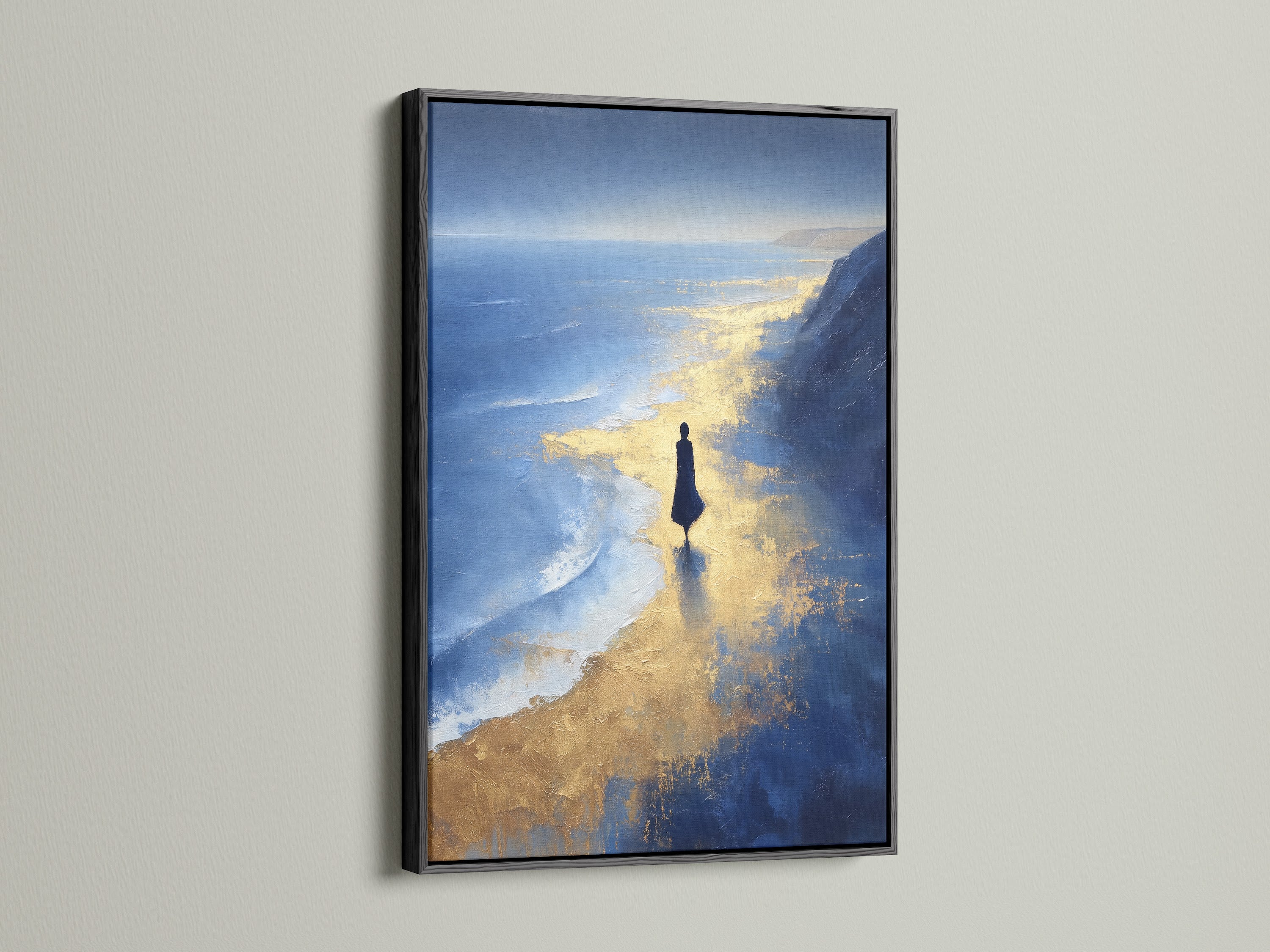 A black frame surrounds the Ocean Reflection art print. This enhances the blue and gold tones of the abstract beach canvas. This piece makes a bold statement as coastal wall art. Perfect for modern minimalist or contemporary styles. Consider this abstract seascape for your office wall.